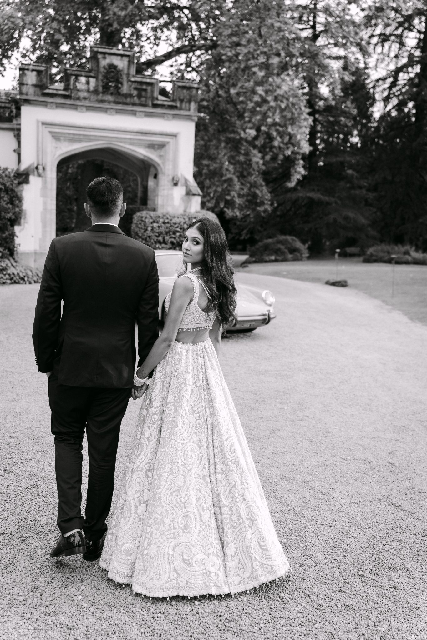 Couple walking towards the entrance of Castello Dal Pozzo on Lake Maggiore