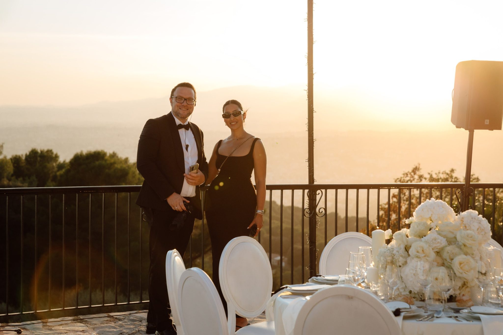 Dennis Brandt and wedding planner Artemis Armelia on a terrace at sunset before a wedding dinner